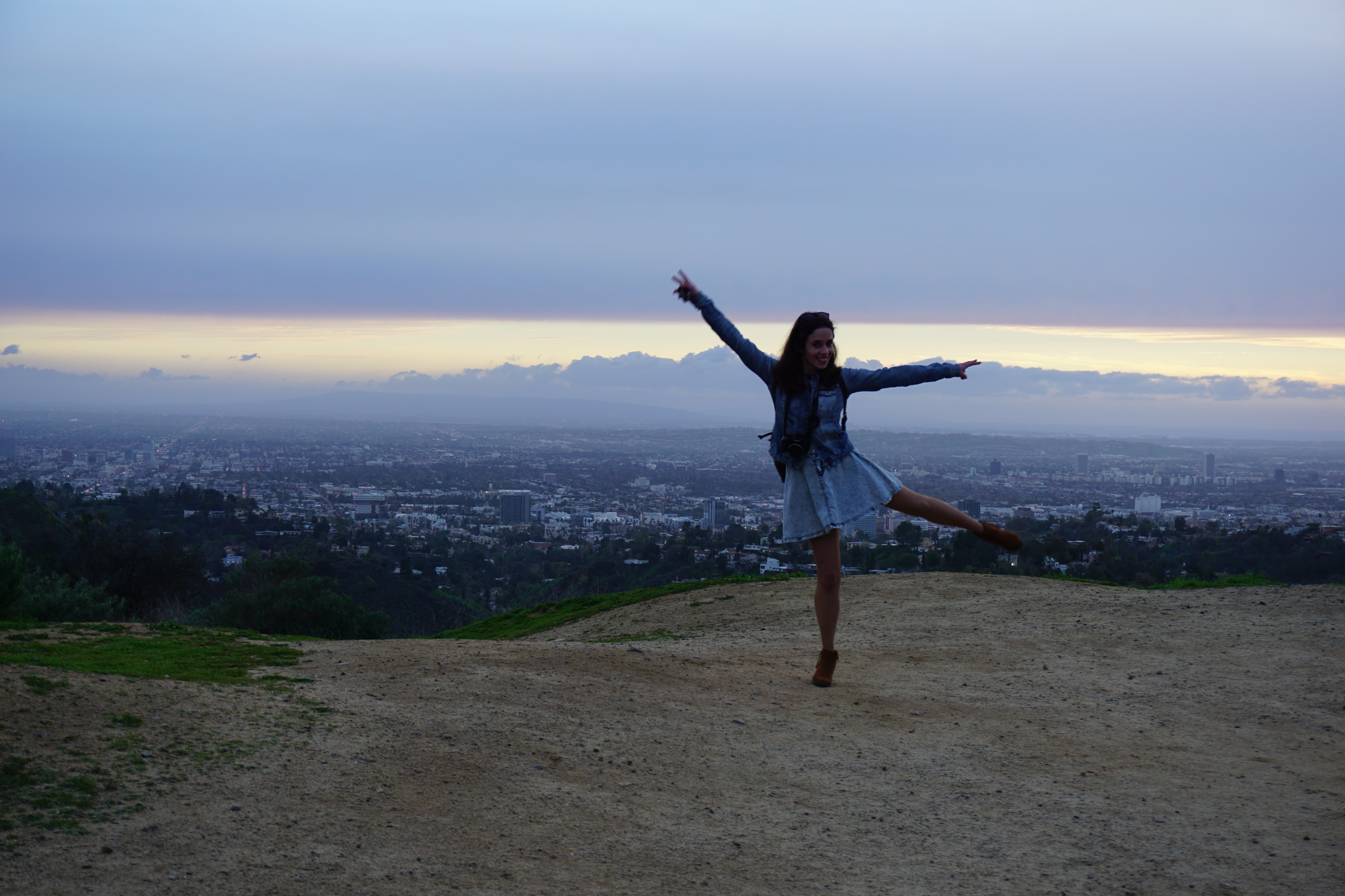Maria dancing in front of a Minnesota skyline.
