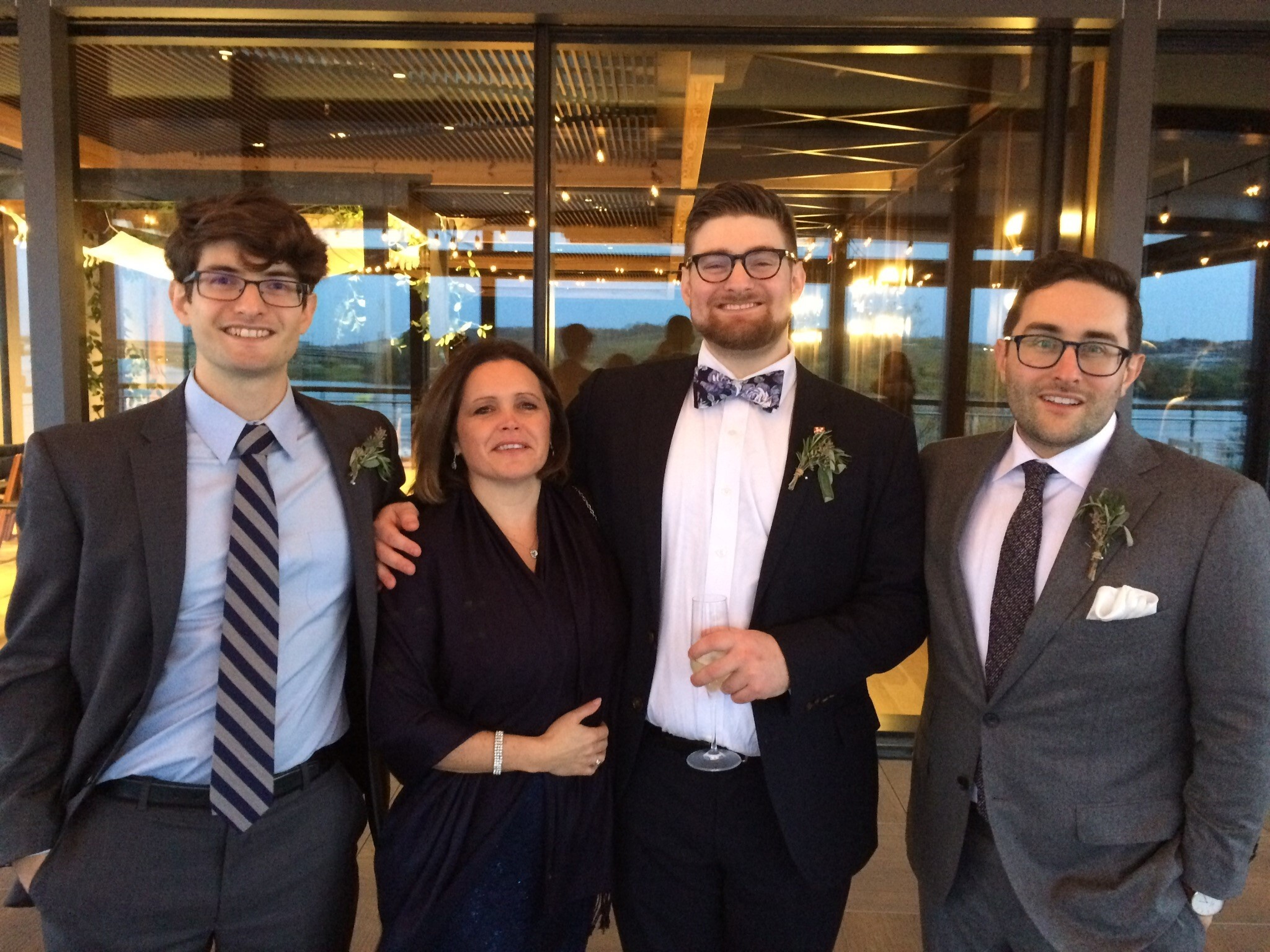 Clare and her three (now all grown-up) host kids at one of her host kid's wedding!