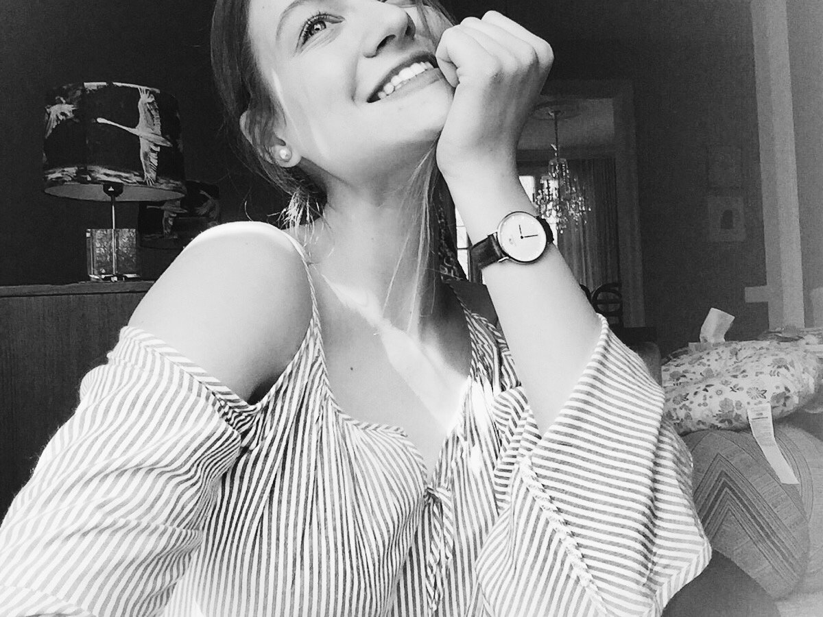 Vanessa at her desk smiling.