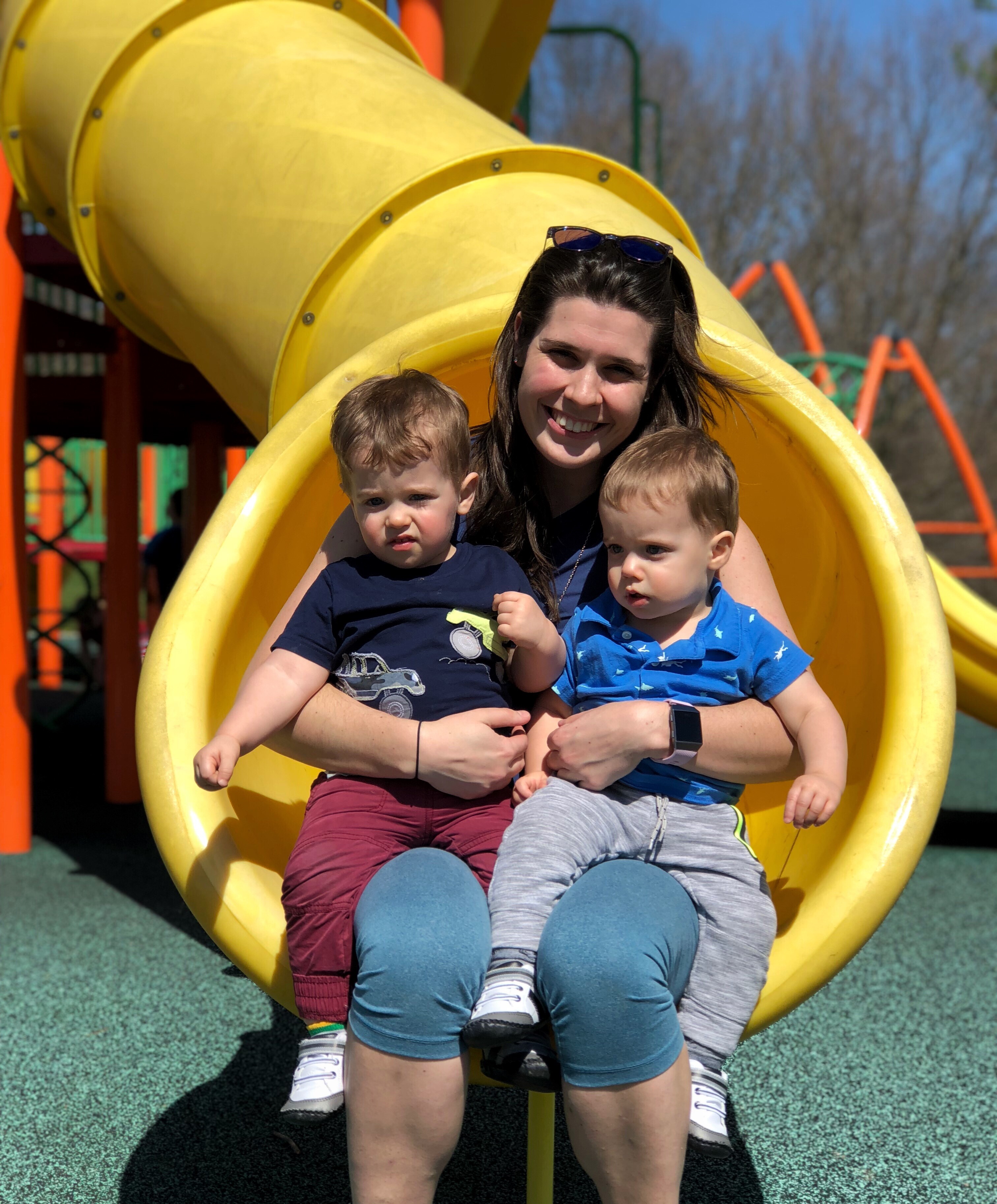Steph and her adorable twin boys on a slide.
