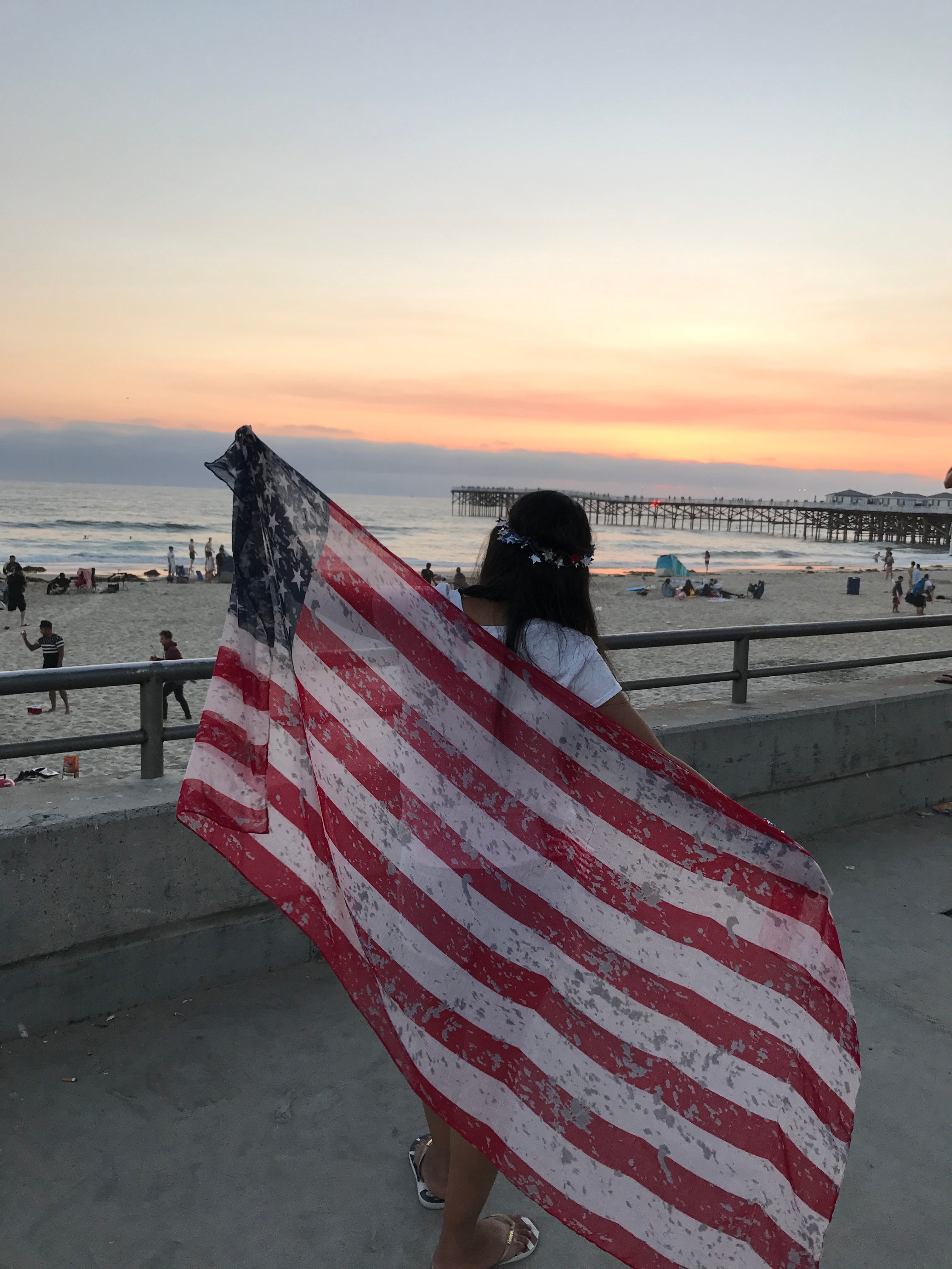In love with America! Mariana proudly carrying the American flag.