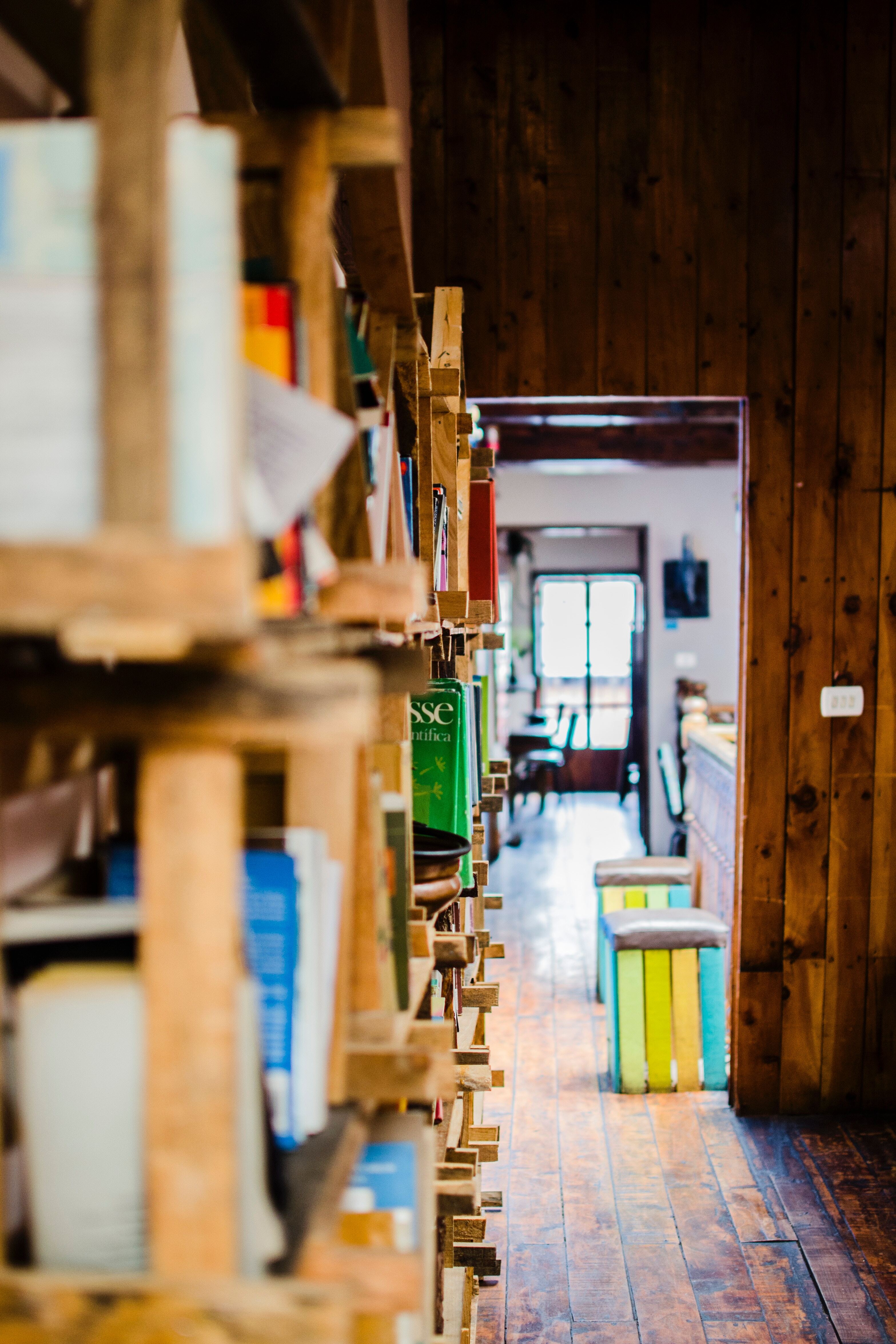 A row of book shelves filled with tons of books.