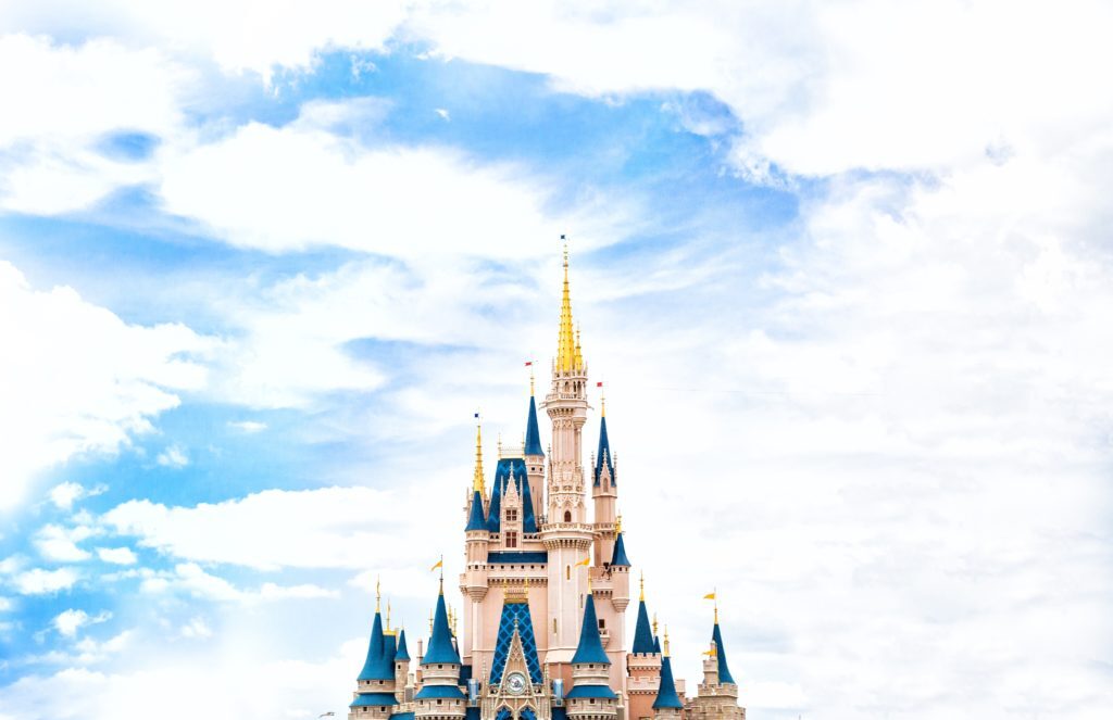 Blue sky with the towers of the icon Disneyland castle in the bottom of the picture